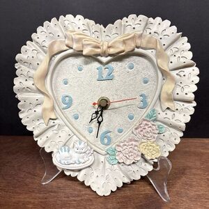 Heart-Shaped Cream Heart Wall Clock with Floral Accents And Ribbon